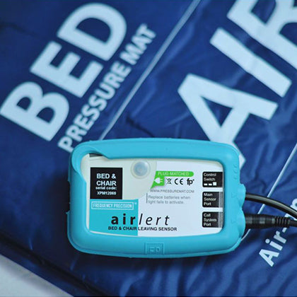 A pressure mat pager on top of a pressure mat