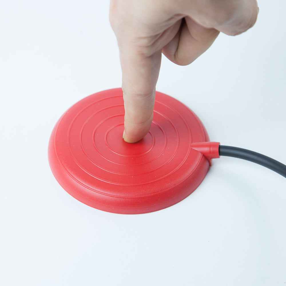 A finger pressing on a press to call button