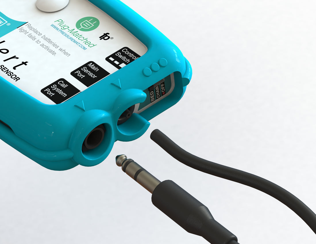 Blue Airlert control box with a cable being inserted into a socket