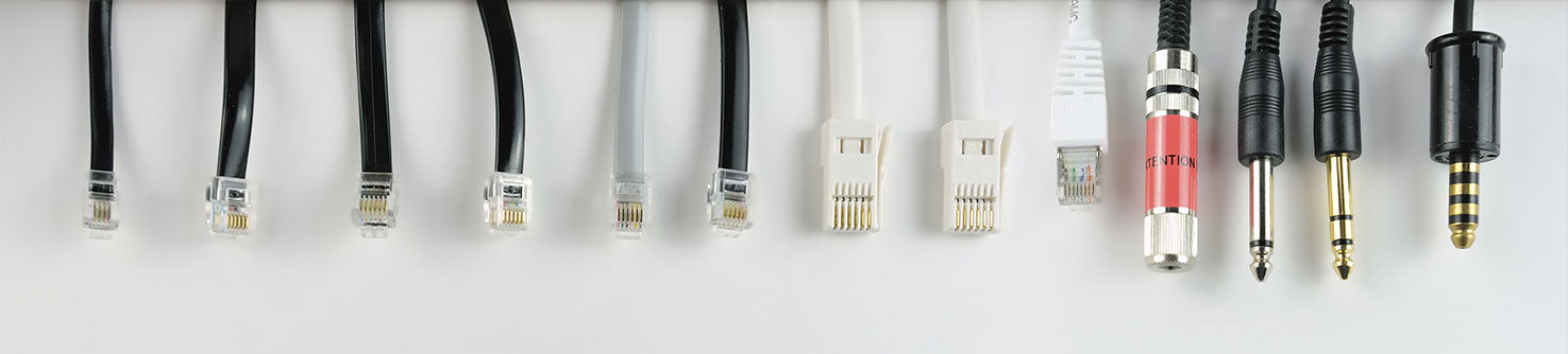 A banner stating 'We can integrate with any call system,' with several cables arranged above, originating from the top