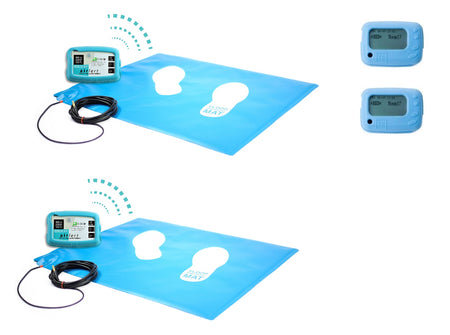 Two wireless floor pressure mats alongside two wireless control boxes