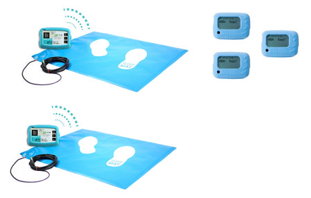 Two wireless floor pressure mats positioned next to three wireless control boxes