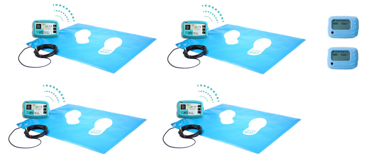 Four wireless floor pressure mats positioned next to two wireless control boxes
