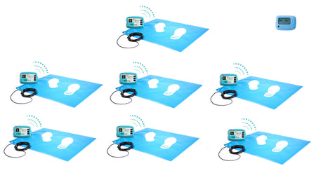 Seven wireless floor pressure mats positioned next to a singular wireless control box