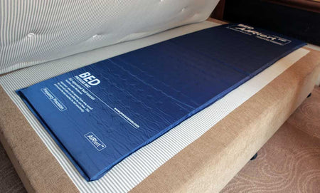 Blue Airlert bed positioned beneath a mattress