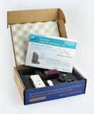 Box containing a door sensor and bleeper pager set, with an open piece of paper displaying instructions
