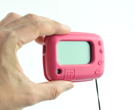 Hand holding a red text pager