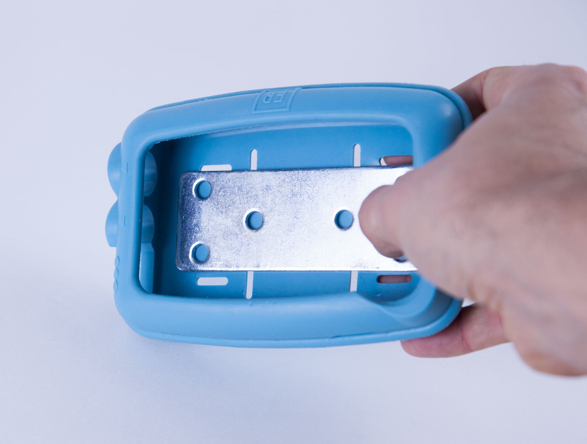 Wall mounting plate inside protective blue rubber case