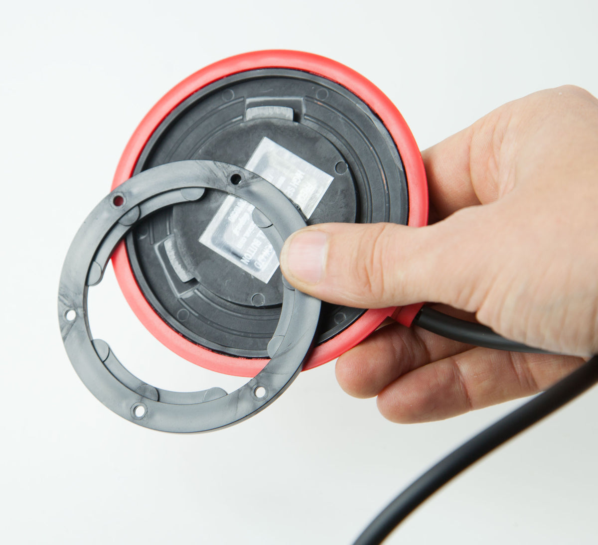 Inside the red easy press touch sensitive button