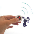 Finger pressing and activating a wireless call button