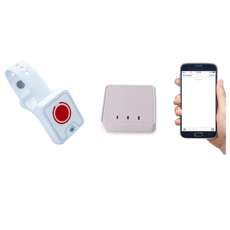 Fall sensor watch placed beside a base station and a mobile phone